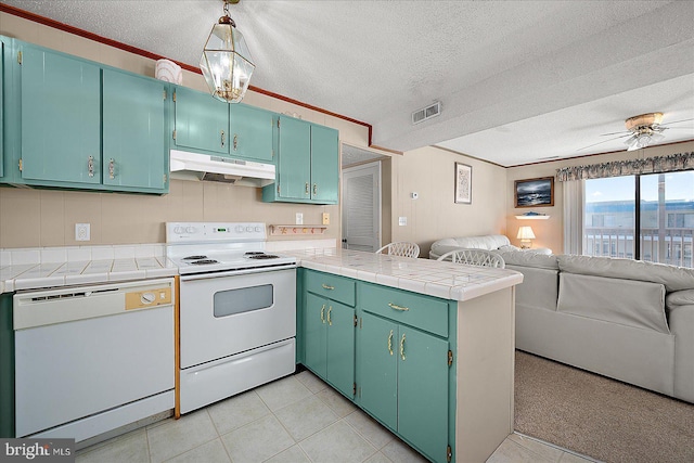 kitchen featuring white appliances, visible vents, a peninsula, under cabinet range hood, and open floor plan