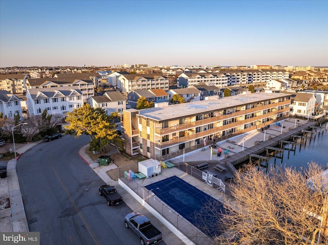 bird's eye view featuring a residential view and a water view