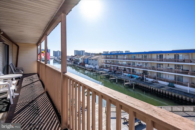 balcony featuring a water view