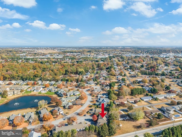 drone / aerial view featuring a residential view and a water view