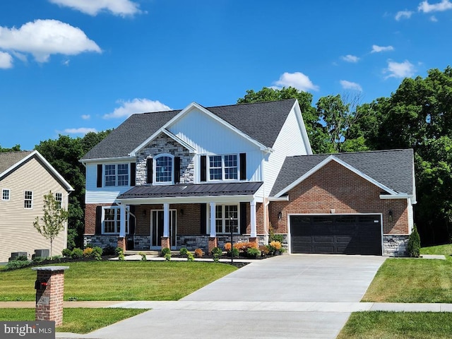 240 Banyan Dr, State College, PA 16801 - view of front of house featuring driveway, covered porch, stone siding, a front yard, and a garage