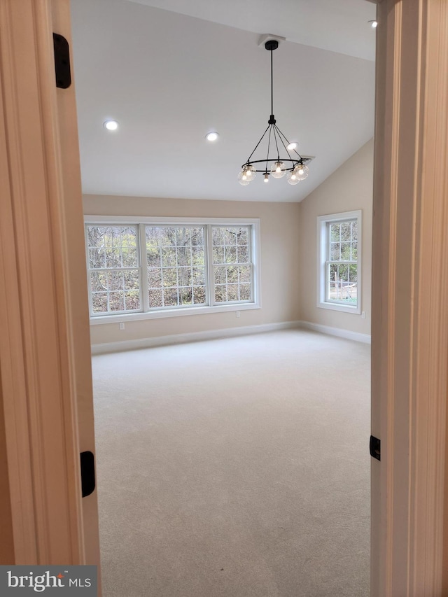 240 Banyan Dr, State College, PA 16801 - empty room with vaulted ceiling, baseboards, a notable chandelier, carpet flooring, and recessed lighting