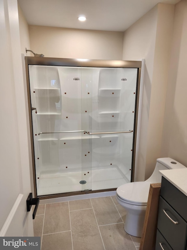 240 Banyan Dr, State College, PA 16801 - bathroom with toilet, recessed lighting, tile patterned flooring, a shower stall, and vanity