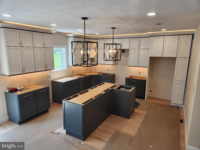 240 Banyan Dr, State College, PA 16801 - kitchen featuring gray cabinets, an inviting chandelier, pendant lighting, a kitchen island, and recessed lighting
