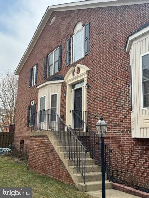 view of property with brick siding