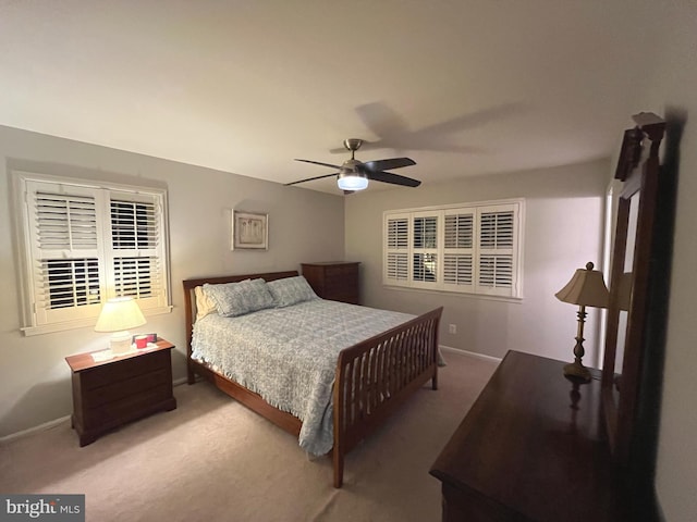 bedroom featuring baseboards, carpet floors, and ceiling fan