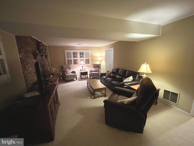 living area with visible vents, carpet, and a brick fireplace