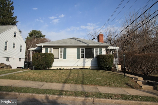 115 Crestmont Ave, State College, PA 16801 - view of front of property featuring a chimney, a front lawn, and roof with shingles