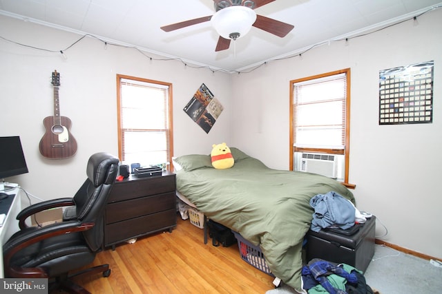 115 Crestmont Ave, State College, PA 16801 - bedroom featuring cooling unit, a ceiling fan, and wood finished floors