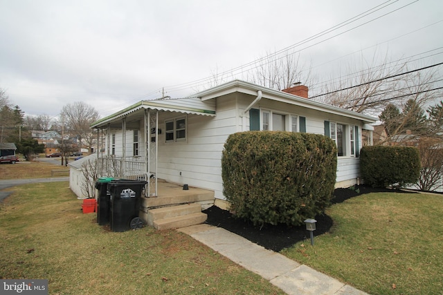 115 Crestmont Ave, State College, PA 16801 - view of front facade with a chimney and a front lawn