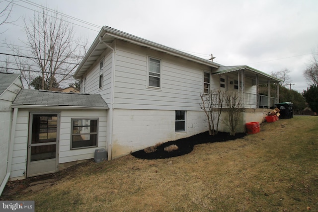 115 Crestmont Ave, State College, PA 16801 - view of home's exterior with a lawn, covered porch, and roof with shingles