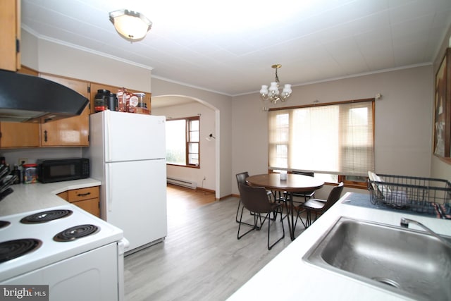 115 Crestmont Ave, State College, PA 16801 - kitchen with white appliances, arched walkways, a sink, light countertops, and under cabinet range hood