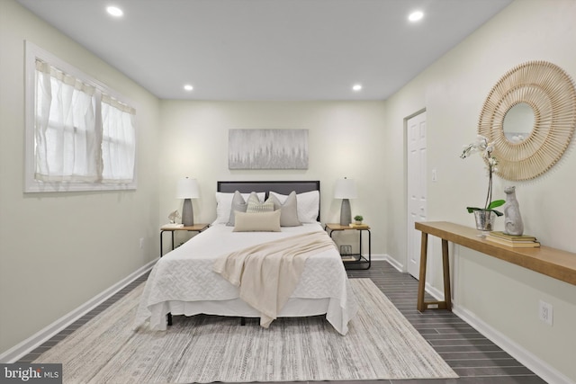 bedroom featuring dark wood-style floors, recessed lighting, and baseboards