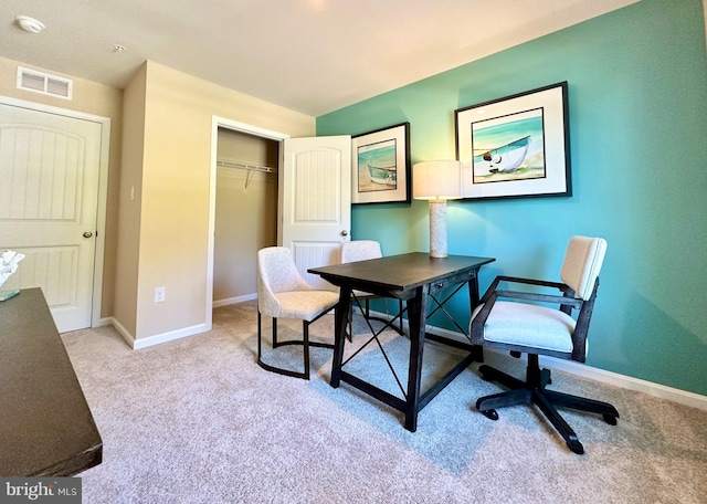 home office with visible vents, light colored carpet, and baseboards