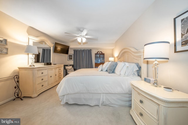 bedroom with light colored carpet and ceiling fan