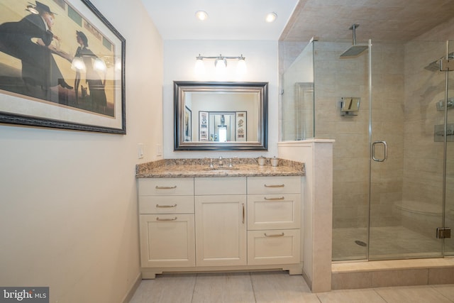 bathroom featuring vanity and a stall shower