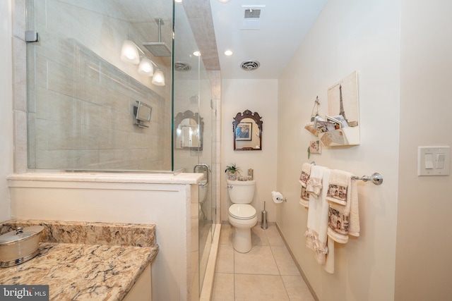 full bathroom with tile patterned floors, visible vents, toilet, and tiled shower