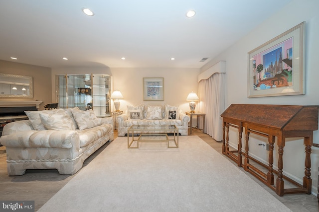 living area with recessed lighting and visible vents