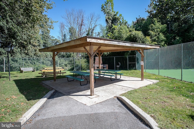 view of home's community featuring a gazebo, a lawn, and fence