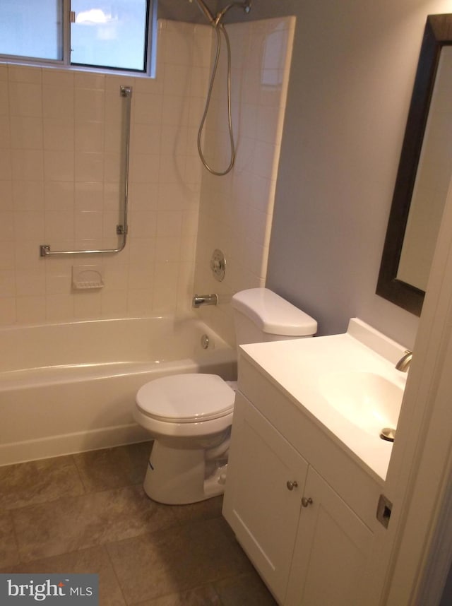 bathroom featuring vanity, toilet, and bathing tub / shower combination