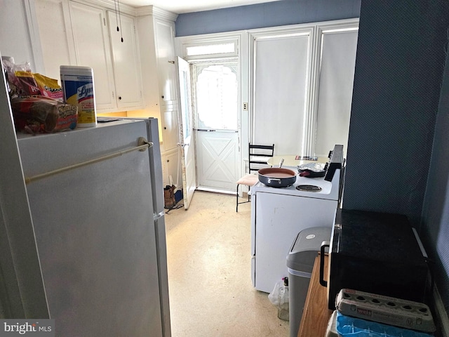 laundry area with light floors