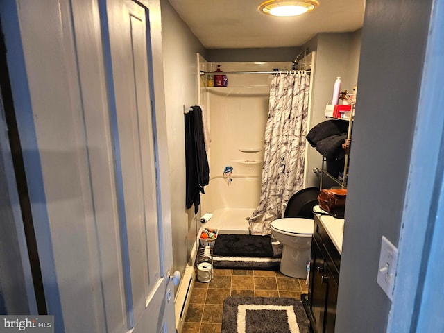 bathroom featuring a shower with curtain, toilet, and vanity