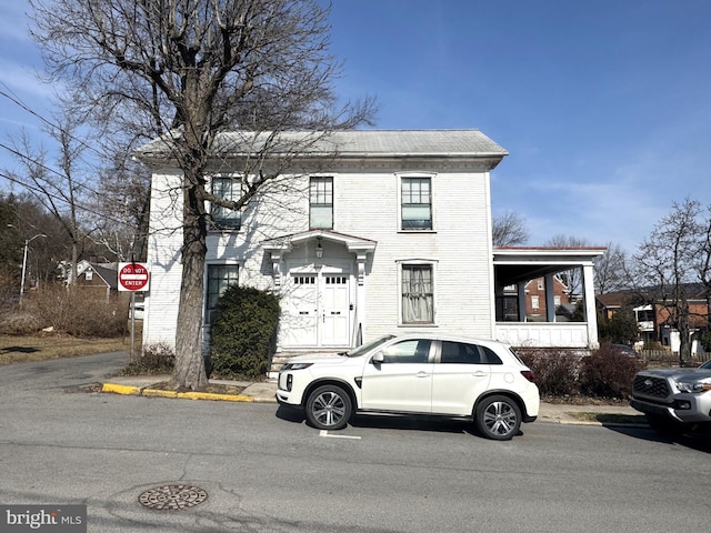 view of front of house with roof with shingles