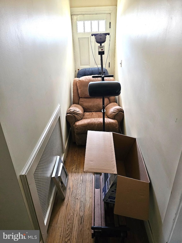 interior space with heating unit and wood finished floors