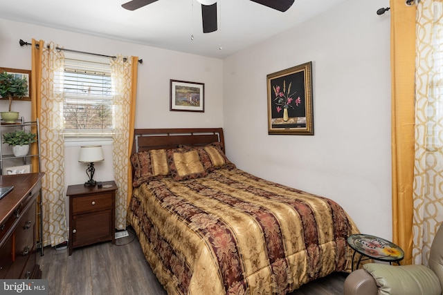 bedroom with dark wood-style floors and a ceiling fan