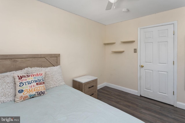 bedroom featuring dark wood-type flooring, baseboards, and ceiling fan