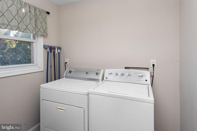 clothes washing area with laundry area and separate washer and dryer