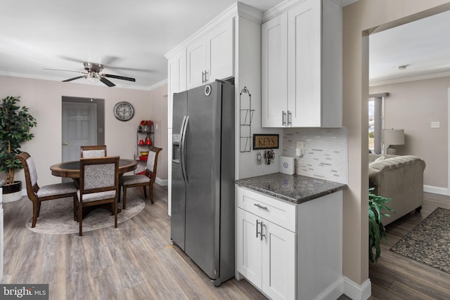 kitchen featuring white cabinets, a ceiling fan, light wood-style flooring, and stainless steel refrigerator with ice dispenser