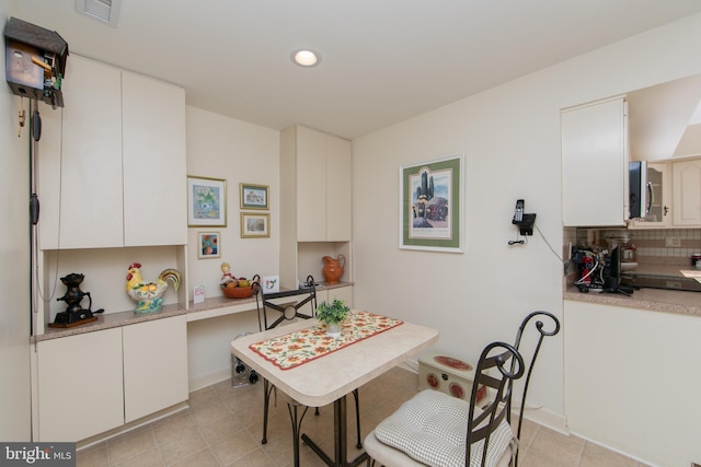 dining space with light tile patterned floors, recessed lighting, and visible vents