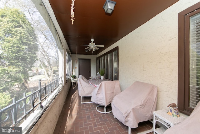 balcony featuring a ceiling fan