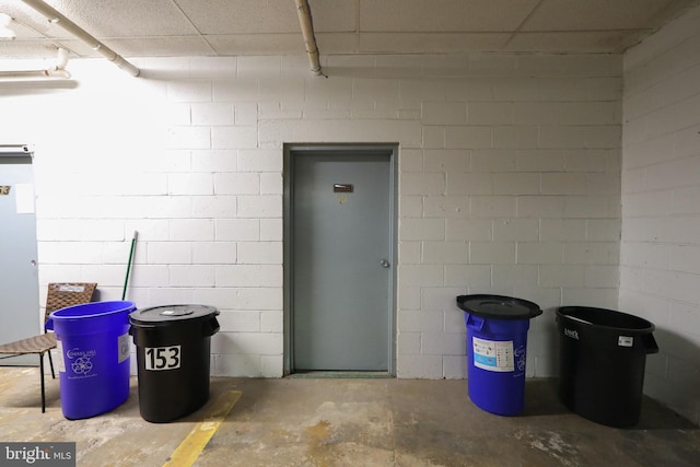 garage with concrete block wall