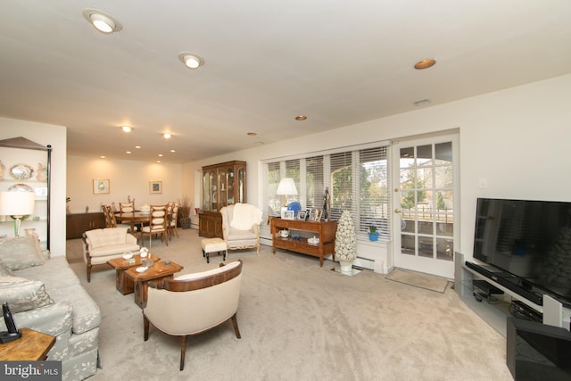 living room with recessed lighting, visible vents, light colored carpet, and baseboard heating