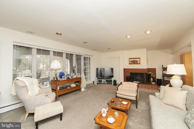 carpeted living area with a baseboard radiator, visible vents, recessed lighting, and a tile fireplace