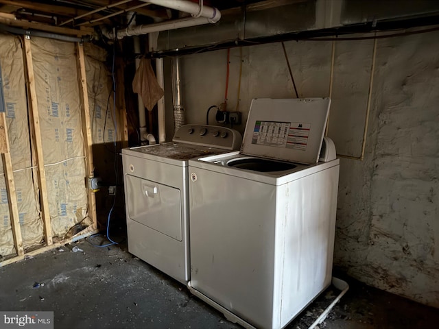 clothes washing area featuring laundry area and separate washer and dryer