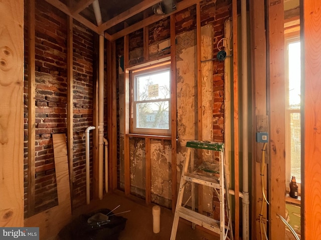 miscellaneous room featuring brick wall