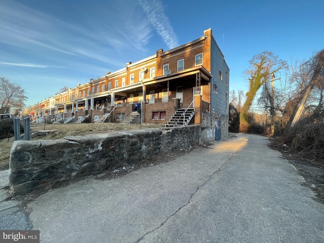 back of house with brick siding