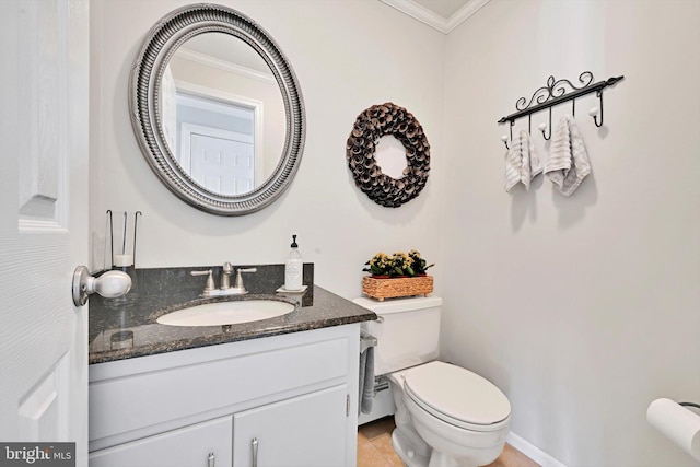 bathroom with vanity, crown molding, toilet, and tile patterned floors