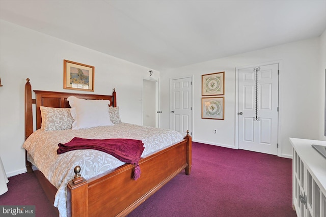 bedroom featuring baseboards and carpet floors