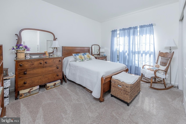 bedroom with carpet and baseboards