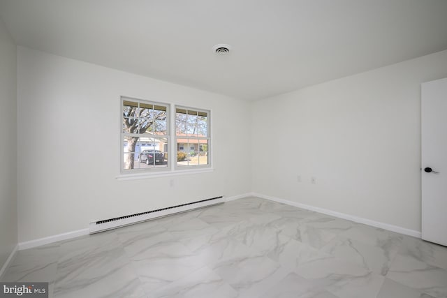 spare room featuring baseboards, visible vents, marble finish floor, and a baseboard radiator