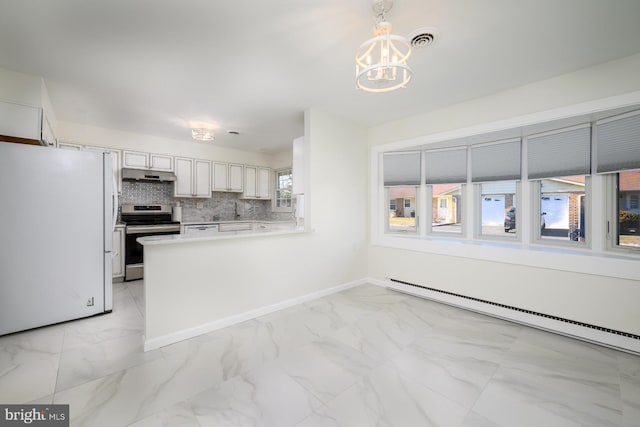 kitchen featuring under cabinet range hood, marble finish floor, stainless steel range with electric stovetop, and freestanding refrigerator