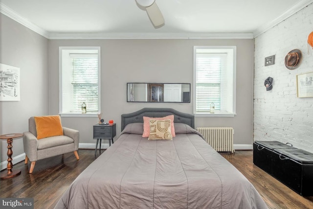 bedroom with baseboards, wood finished floors, ornamental molding, and radiator heating unit