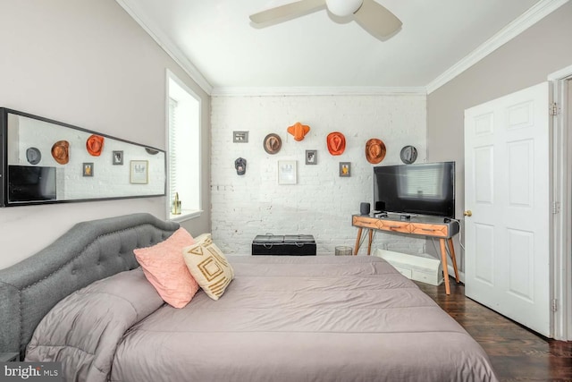 bedroom featuring ceiling fan, wood finished floors, brick wall, and ornamental molding