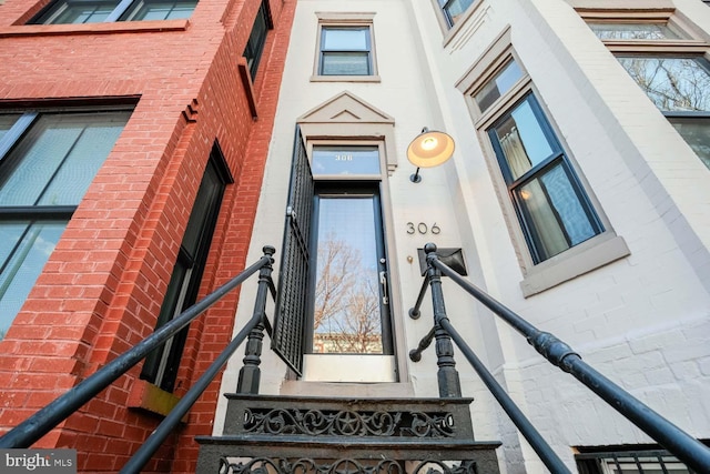 entrance to property with brick siding