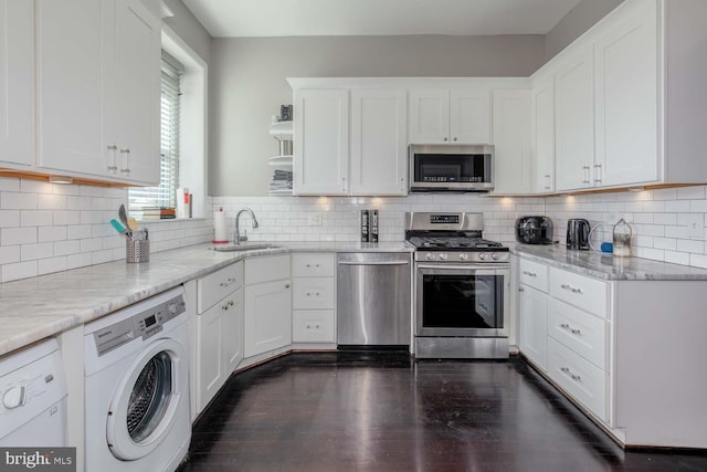 kitchen featuring a sink, washer / dryer, appliances with stainless steel finishes, white cabinets, and open shelves