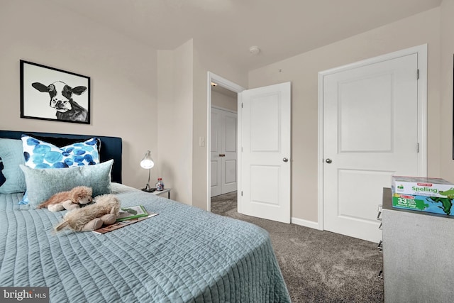 carpeted bedroom featuring baseboards